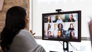 A group of coworkers meet on a videoconference.