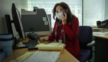 City of Stamford contact tracer Toni Parlanti calls a person identified as having been potentially exposed to coronavirus while working from her office at the Government Center on December 22, 2020 in Stamford, Connecticut.