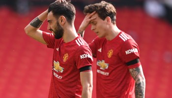 Two Manchester United players, Bruno Fernandes (left) and Victor Lindelöf, hold their heads during a match against Burnley on April 18, 2021.