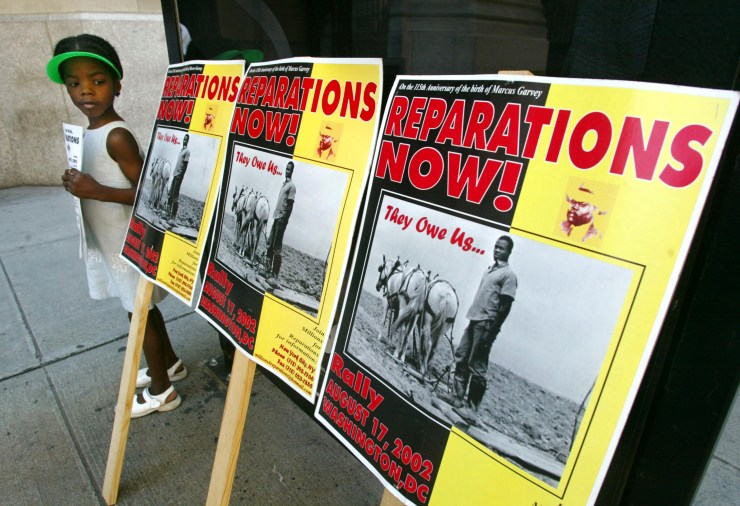 A slavery reparations protest outside New York Life Insurance Company offices August 9, 2002 in New York City.