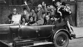 A carload of flappers in 1929. The economy is fundamentally different today than it was 100 years ago, but there are some parallels.