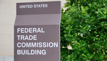 A sign reads "Federal Trade Commission Building" in downtown Washington, D.C.
