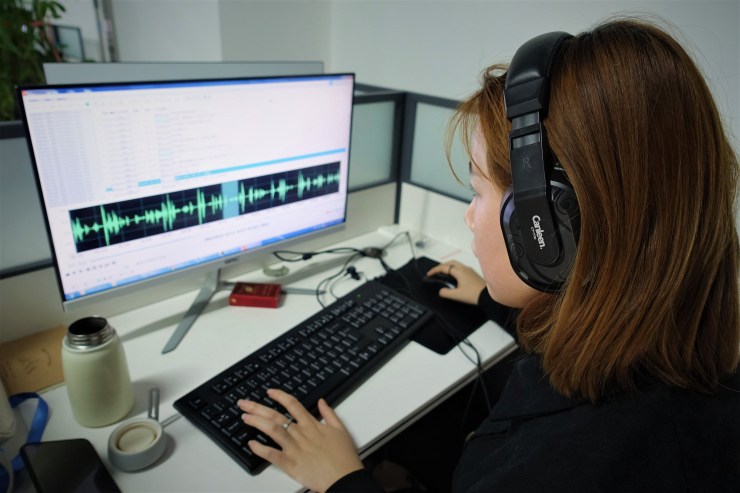 Guo Rui labels up to 50 minutes of audio samples a day. (Charles Zhang/Marketplace)