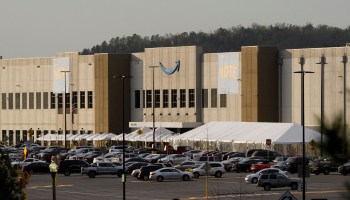 Signs reading "vote" hang outside the Amazon.com, Inc. BHM1 fulfillment center on March 28, 2021 in Bessemer, Alabama.