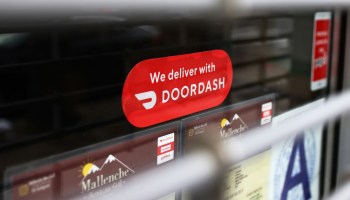 A Doordash sticker is seen on a window at Mallenche Mexican Grill in the Flatbush neighborhood of Brooklyn on Dec. 4, 2020, in New York City.