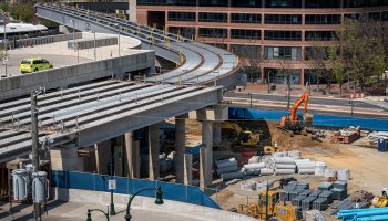 Construction continues near unfinished Purple Line rail tracks at the Paul Sarbanes Transit Center on April 8, 2021, in Silver Spring, Maryland.