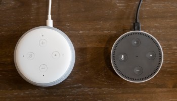 An updated "Echo Dot" (left) is pictured next to an older generation "Echo Dot" at Amazon Headquarters, on Sep. 20, 2018, in Seattle Washington.