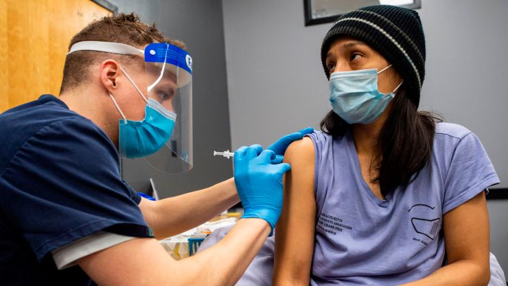A person receives a COVID-19 vaccination.