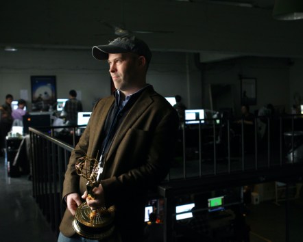 Chris Bremble holds an Emmy he received in 2010 for Outstanding Visual Effects for Base Media's work on HBO’s miniseries The Pacific. (Courtesy Base Media)