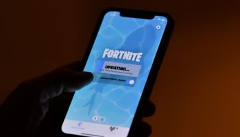 This illustration picture shows a person waiting for an update of Epic Games' "Fortnite" video game on their smartphone in Los Angeles, California, on August 14, 2020.