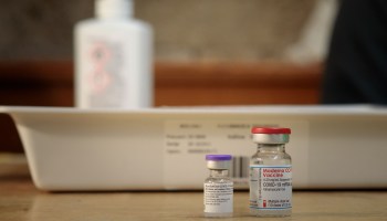 Vials of the Pfizer-BioNTech COVID-19 vaccine (left) and the Moderna vaccine.