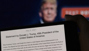 A statement from former President Donald Trump appears on a computer screen.