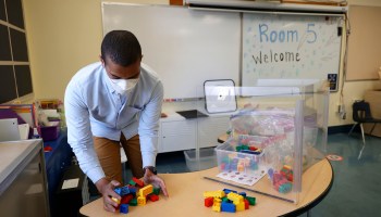 Bryant Elementary School kindergarten teacher Chris Johnson sets up building blocks on a table in his classroom on April 9, 2021 in San Francisco, California.