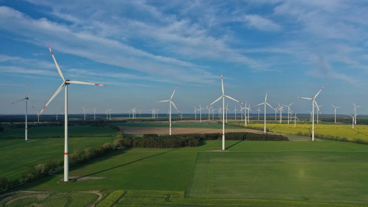 In this aerial view, wind turbines are seen spinning on May 10, 2021 near Bernau, Germany.