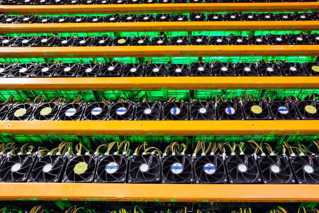 Many computer units mining Bitcoin are stacked on shelves at BitFarms in Saint Hyacinthe, Quebec, on March 19, 2018.