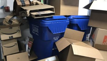 Cardboard overflowing recycling bins. With home delivery a big part of the lockdown experience, Matt Reynolds says consumers are "asking brands to be more aware" of container sustainability.