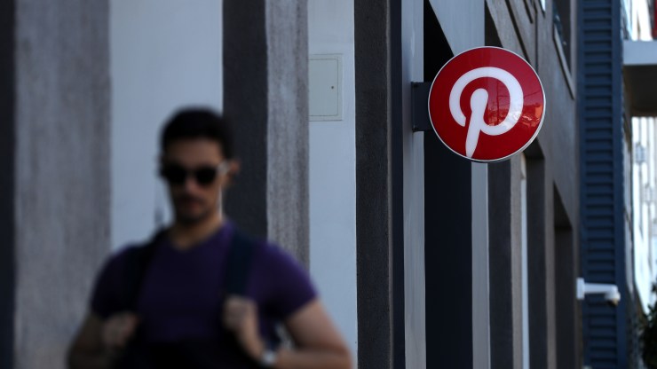 A pedestrian walks by the Pinterest headquarters on April 9, 2019 in San Francisco, California.