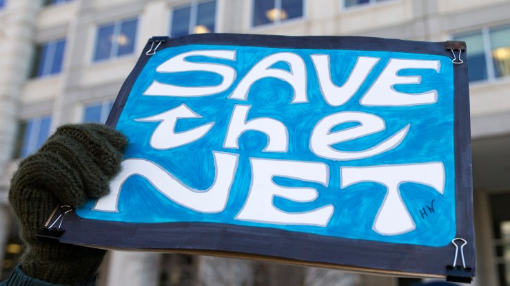 A "Save the Net" protest sign during a demonstration against the proposed repeal of net neutrality outside the Federal Communications Commission headquarters in Washington, D.C., on December 13, 2017.