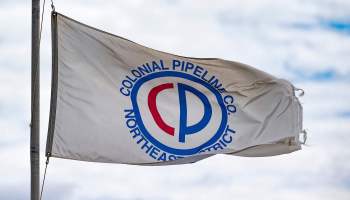 A Colonial Pipeline flag flies in the wind.