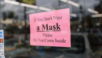 A sign at a convenience store reads, "If You Don't Wear a Mask Please Do Not Come Inside."
