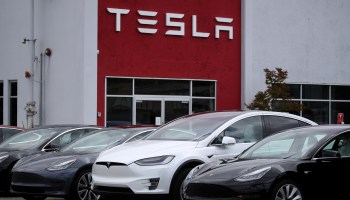 Tesla cars are parked in front of a Tesla showroom and service center on May 20, 2019 in Burlingame, California.
