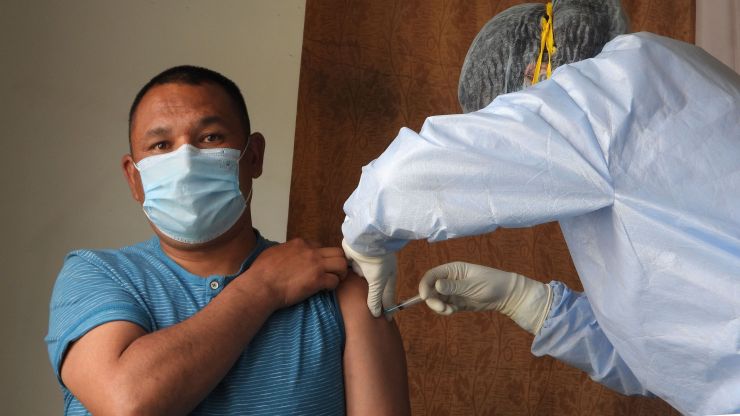A man receives a COVID-19 vaccination.