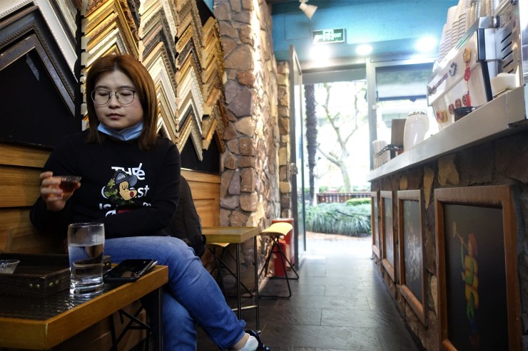 Xiong Luying said the coffee culture is not as developed in Wuhan city, where she works, so she seeks out boutique coffee shops every time she visits Shanghai (Charles Zhang/Marketplace)