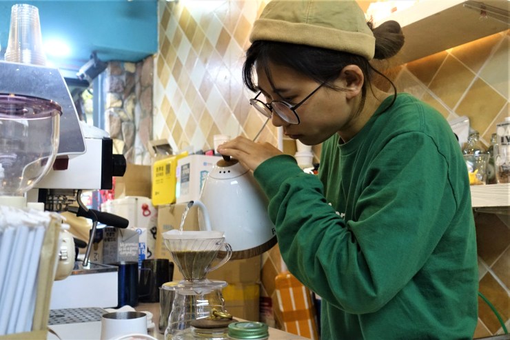 Juzi started out as a barista and said the pandemic allowed her to realize her dream to open her own coffee shop. Many others had the same idea in Shanghai  (Charles Zhang/Marketplace)