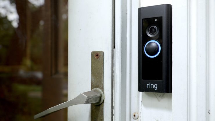 A doorbell device with a built-in camera made by home security company Ring is seen in 2019 in Silver Spring, Maryland.