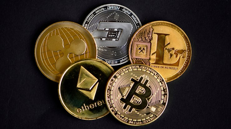 The photo shows physical imitations of various cryptocurrencies in Dortmund, western Germany, on January 27, 2020.