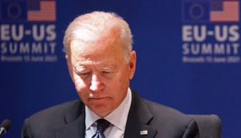 President Joe Biden reads a document during an EU-U.S. summit at the European Union headquarters in Brussels on June 15, 2021.