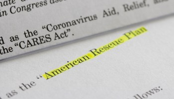 A closeup of the CARES Act and American Rescue Plan Act COVID relief legislation.