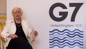 U.S. Treasury Secretary Janet Yellen at Lancaster House on June 5, 2021 in London, England. She sits in front of a sign reading "G-7 United Kingdom 2021."