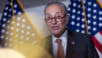 Senate Majority Leader Charles Schumer, D-N.Y., stands in front of two American flags and speaks at a press conference following a Senate Democratic luncheon on Capitol Hill on June 8, 2021 in Washington.