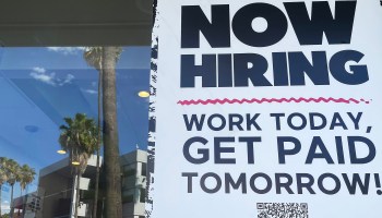 A "Now Hiring" sign is displayed at a fast food chain on June 23, 2021 in Los Angeles, California.