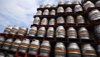 Kegs stacked outside distribution for a brewery in Reydon, England. A supply chain management exercise known as the “beer game” can help illustrate the forces creating shortages across the economy.