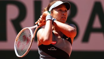 Naomi Osaka playing a backhand in her first round match against Patricia Maria Tig of Romania during Day One of the 2021 French Open.