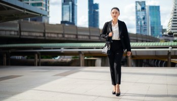 business woman walking in the city