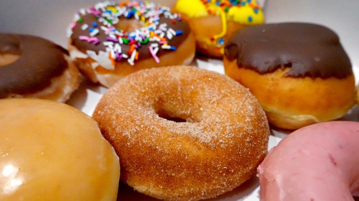 A close-up photo of a box of donuts.