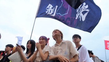 Young Chinese listening to punk music at the MIDI rock music festival in June.