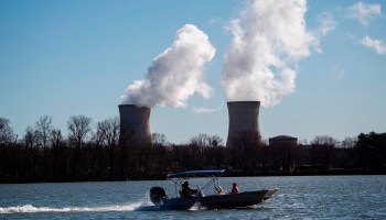 A boat passes the nuclear plant on Three Mile Island as seen from Goldsboro, Pennsylvania, with the operational plant run by Exelon Generation, across the Susquehanna river in Middletown, Pennsylvania on March 26, 2019.