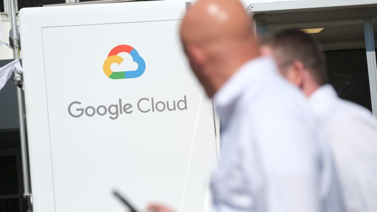 People walk past a Google Cloud exhibit during the press days at the 2019 IAA Frankfurt Auto Show on September 11, 2019 in Frankfurt am Main, Germany.