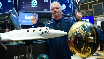 Sir Richard Branson, founder of Virgin Galactic, poses for photographs before ringing a ceremonial bell on the floor of the New York Stock Exchange (NYSE) to promote the first day of trading of Virgin Galactic Holdings shares on October 28, 2019 in New York City.
