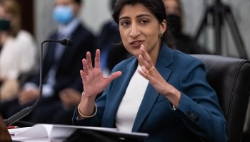 Then-FTC Commissioner nominee Lina M. Khan gestures with her hands in a congressional hearing.