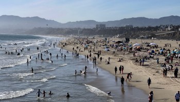 People enjoy the warm weather on Santa Monica beach on April 30 in Santa Monica, California.