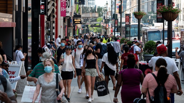 Shoppers walk through downtown Manhattan.
