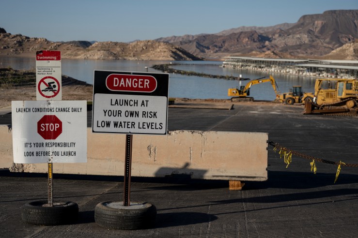 Signs indicate that a boat ramp is closed due to low water levels in Lake Mead near Las Vegas on June 10, where the water level has fallen to its lowest since the reservoir was filled in the 1930s.
