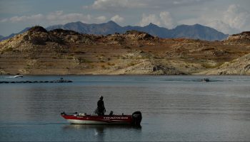 A visitor launches a boat near the Lake Mead Marina as a "bathtub ring" is visible during low water levels due to the western drought on July 19, 2021 at Lake Mead on the Colorado River in Boulder City, Nevada.