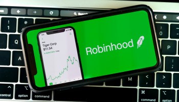 Photo illustration shows the logo of trading application Robinhood on a mobile phone.