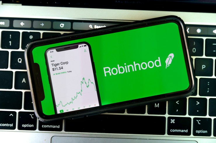 Photo illustration shows the logo of trading application Robinhood on a mobile phone.